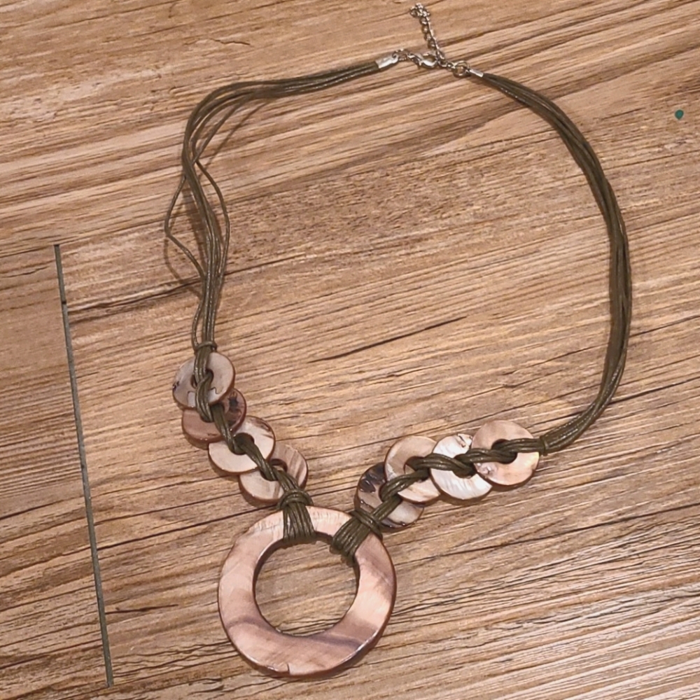 Polished shell and cord necklace